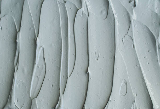 gray-bentonite-facial-clay-texture-close-up-selective-focus-abstract-background-with-brush-3260994181.webp