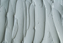 gray-bentonite-facial-clay-texture-close-up-selective-focus-abstract-background-with-brush-3260994181.webp